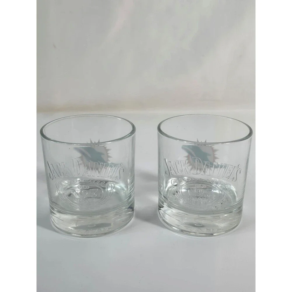 Jack Daniel's promotional NFL rocks glasses featuring the Miami Dolphins logo